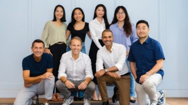 FEBE Ventures' team standing against a blue wall