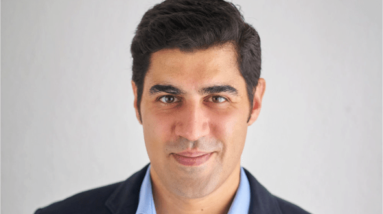 Head shot of Dr. Parag Khanna, founder and CEO of Climate Alpha, pictured against a white background