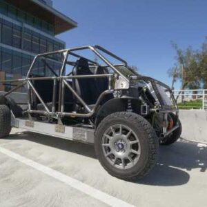 Telo Trucks' roll cage prototype sits in a sunny parking lot.